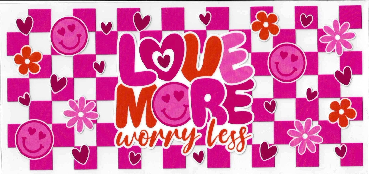 Decorative banner with 'Love more worry less' text surrounded by smiley faces, hearts, and flowers on a pink checkered background.