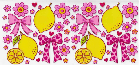 Decorative design with lemons, pink bows, and flowers on a white background