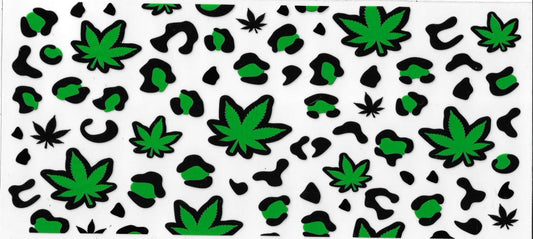 Pattern of green cannabis leaves and black abstract shapes on a white background